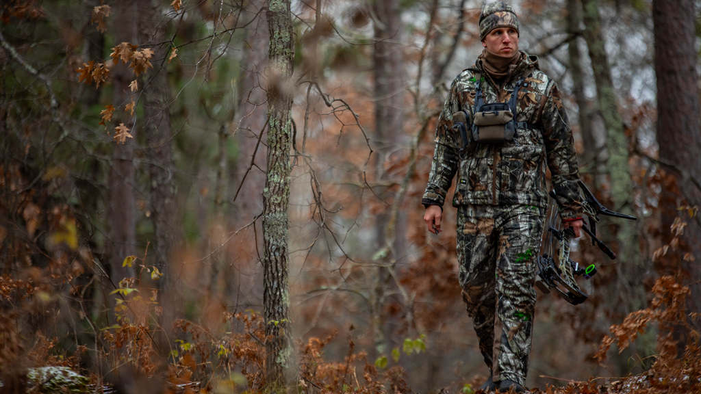 the hunter is hunting rut deer in the wild