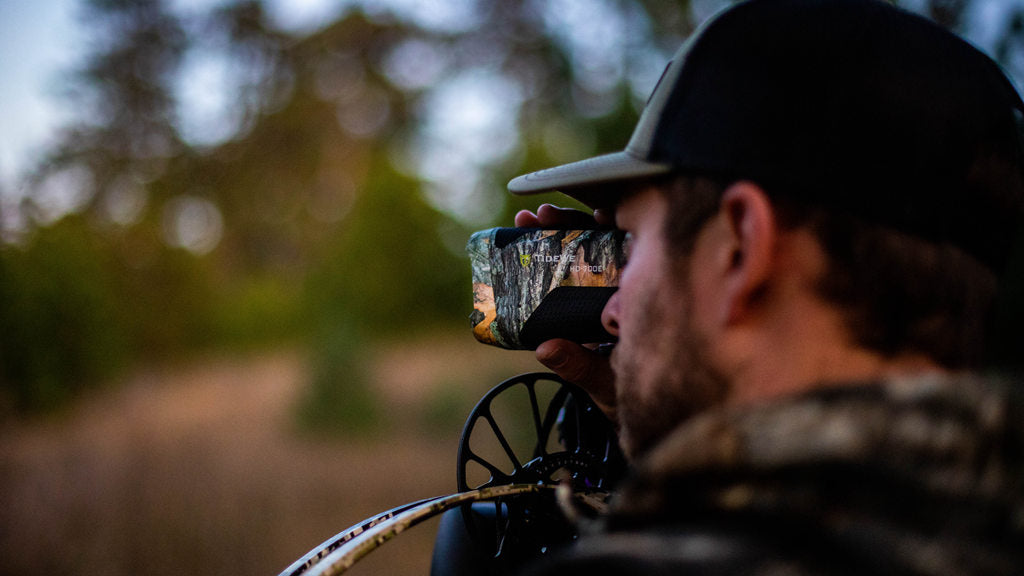the hunter uses rangefinder to  judge distance