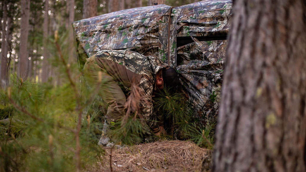 a hunter is building the ground blind