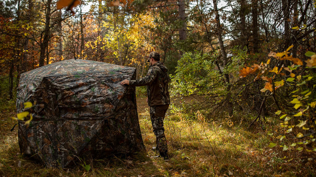 a hunter is check his hunting blinds in the wild