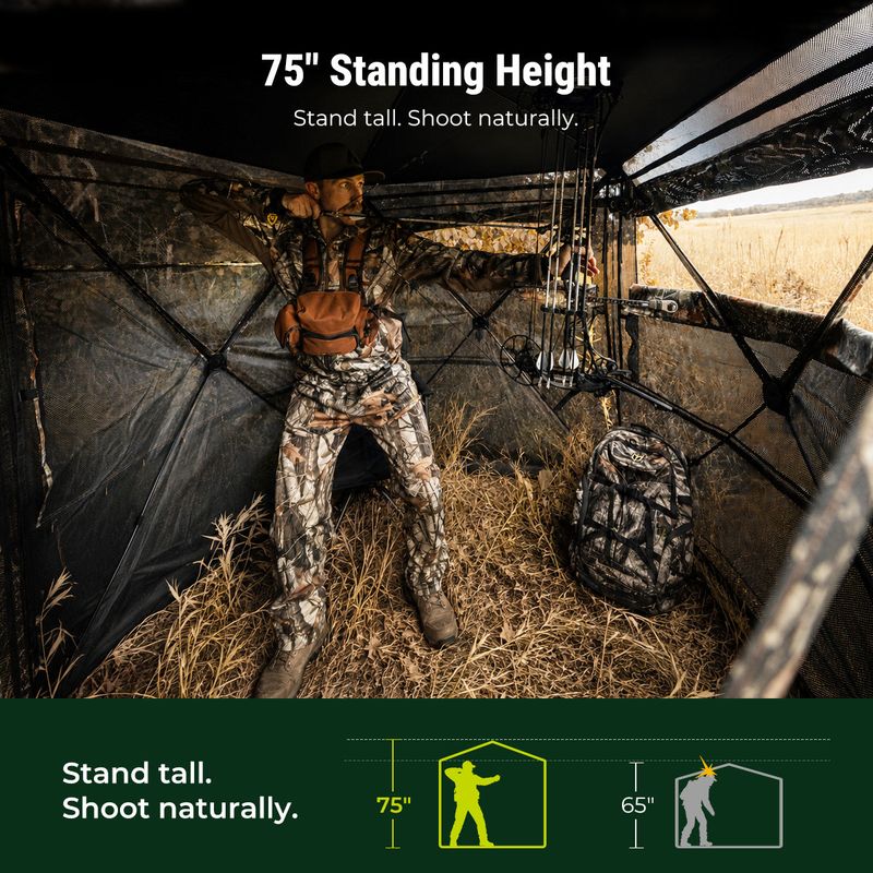 Bowhunter drawing at full standing height inside the TIDEWE VisTall 360 ground blind