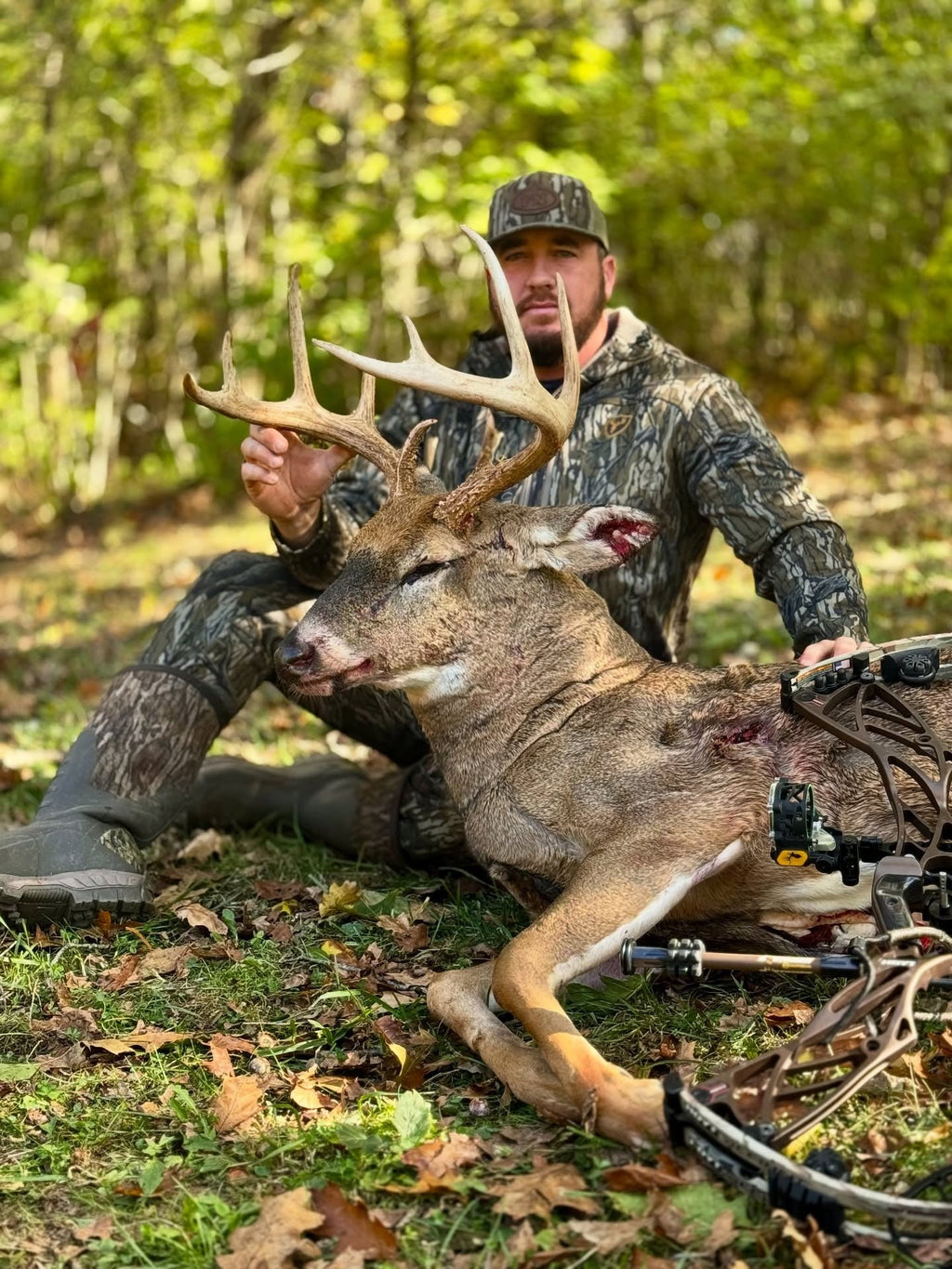 kid in blue-t-shirt and brown pants sitting on brown wooden seat during daytime