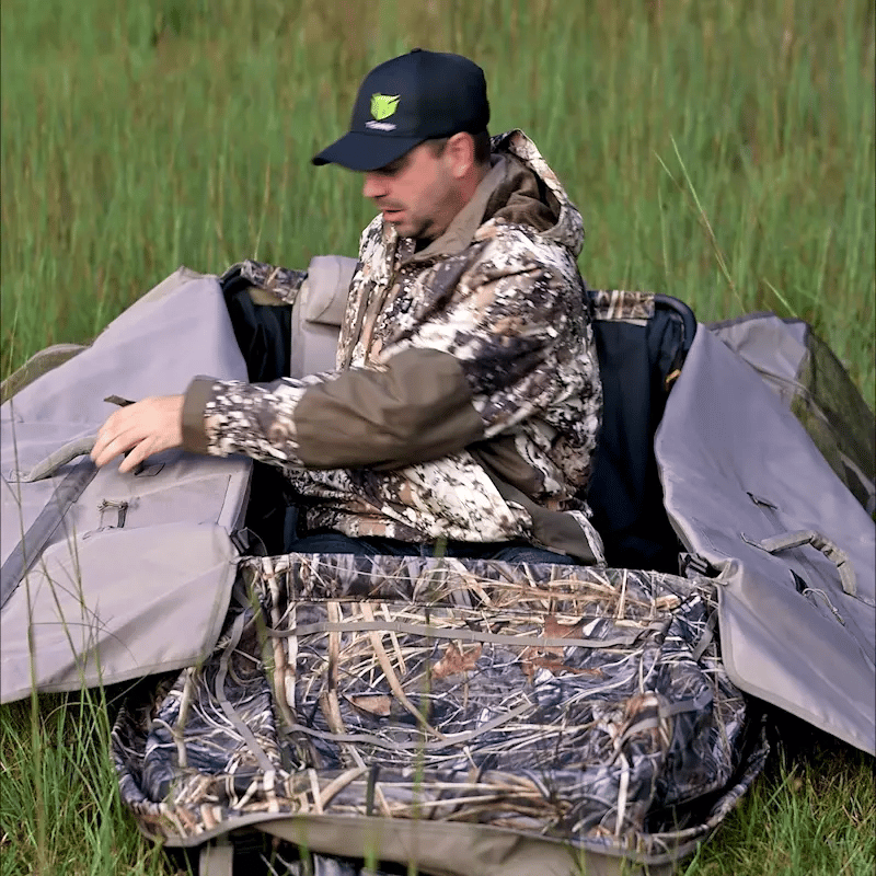 a hunter sits in the hunting blind 