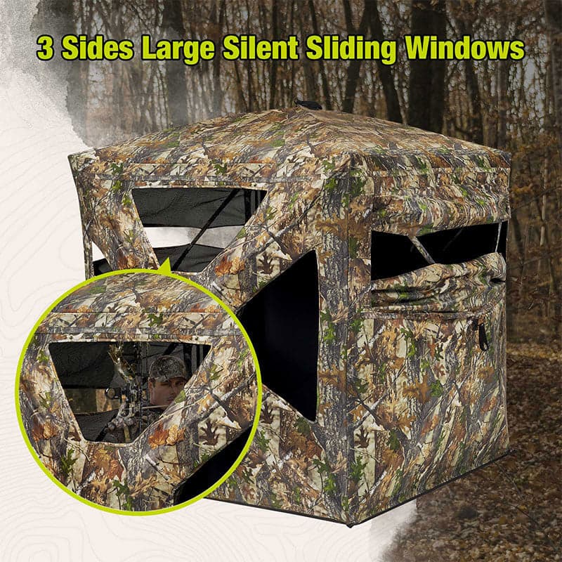 TideWe ground blind with sliding windows, man hunting in camouflage tent with gun, vehicle, bow and arrow, and striped flag.