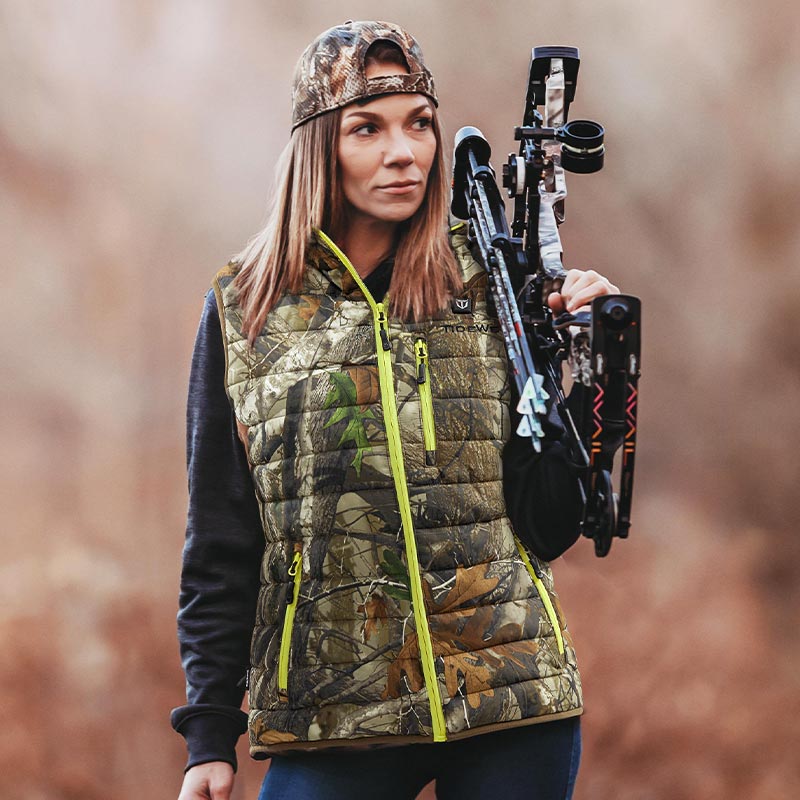 a woman wears heated vest for hunting 